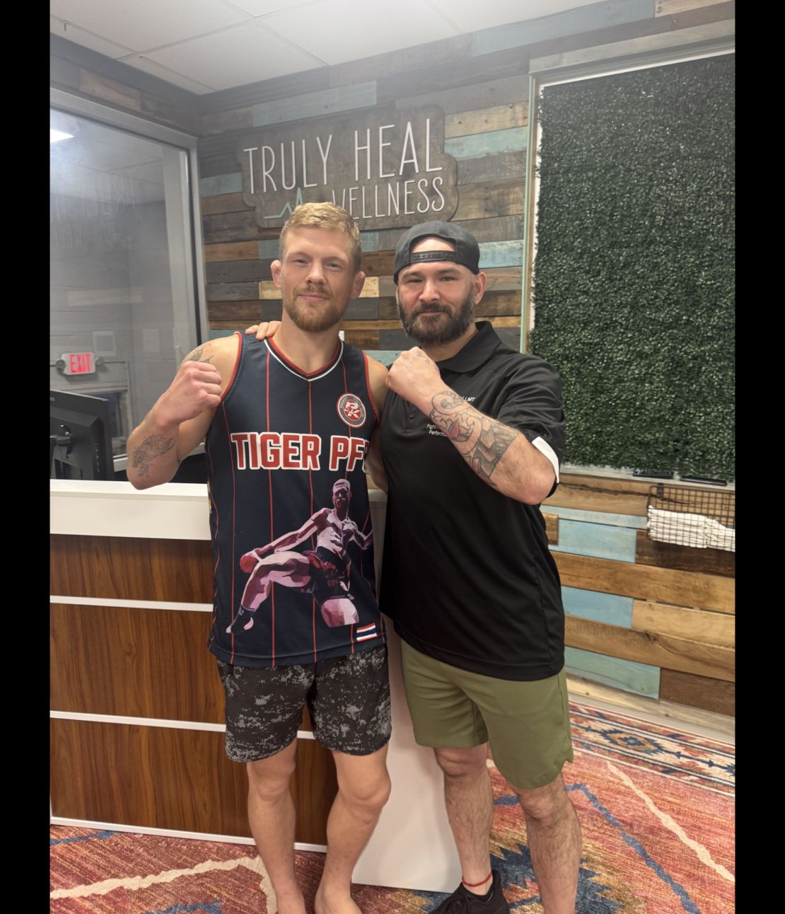 Prfessional fighter Dusty Shaffer posing in a fight stance at Truly Heal Wellness in Akron, Ohio